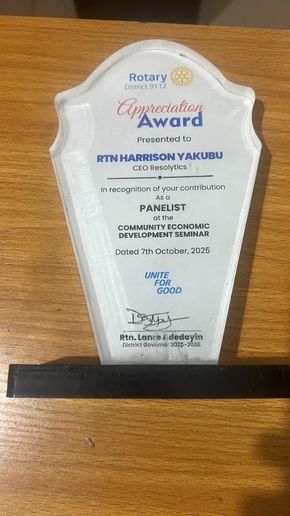 Rotary District 9112 Appreciation Award presented to RTN Harrison Yakubu CEO Resolytics as Panelist